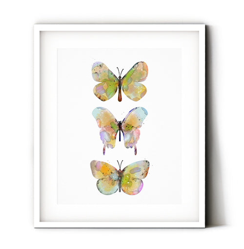 Butterflies art print. A trio of watercolor yellow butterflies makes the perfect touch to your home decor. A soft yellow palette mixed with whimsy, make this butterfly wall art a great additon to your deorating. A little bit of nature and a lot of fun, our butterflies are ready to liven up your summer decorating style. Receive a high-quality reproduction from our original yellow butterflies artwork printed onto your choice of paper or a ready-to-hang canvas.